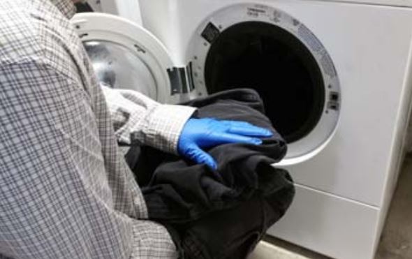 Laundering pesticide-contaminated clothing