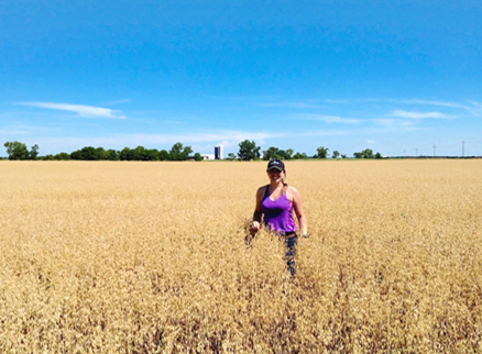 Student researcher Andi Nichols in a soybean field