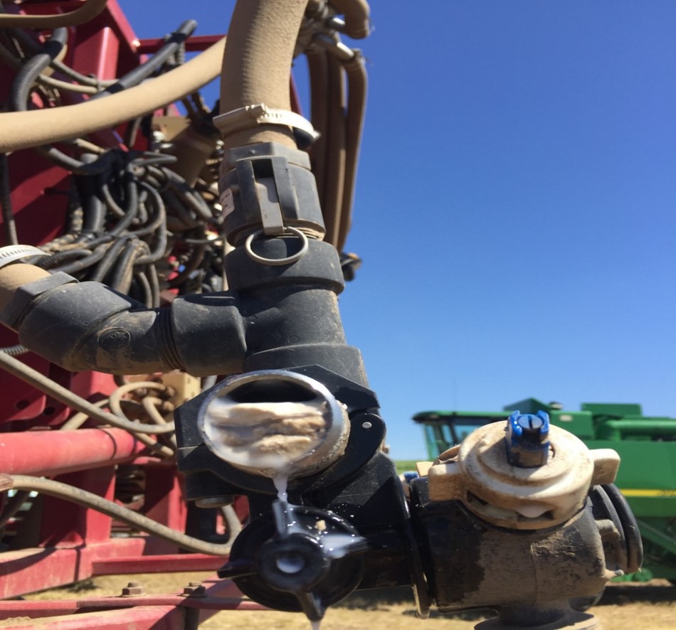 chemical build-up at the end of a sprayer boom