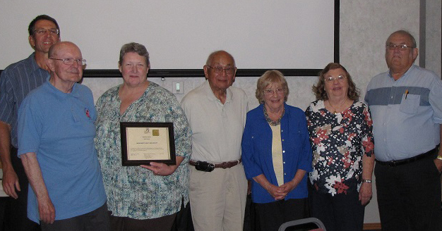 Representatives of the Monument Valley Iris Society receiving the SWCS Merit Award