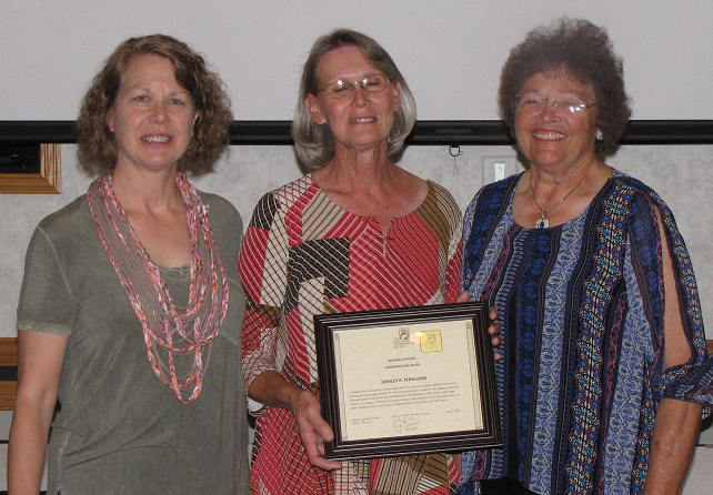 Shirley Ferguson (center) receives an SWCS Commentation Award