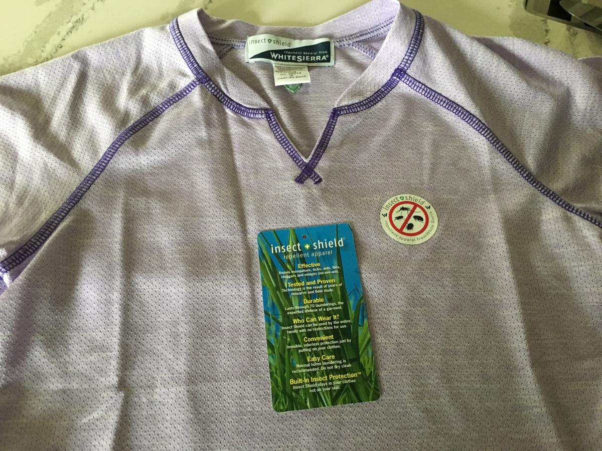 A shirt commercially treated with permethrin