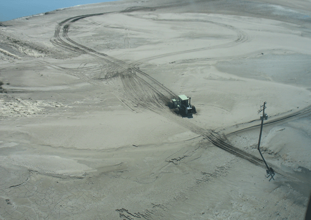Sand-covered, flooded farmland
