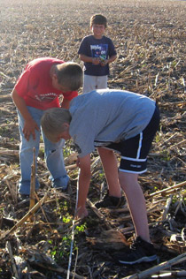 boys participating in crop residue activity