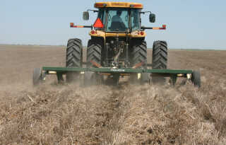 Blade plow operating in wheat stubble.