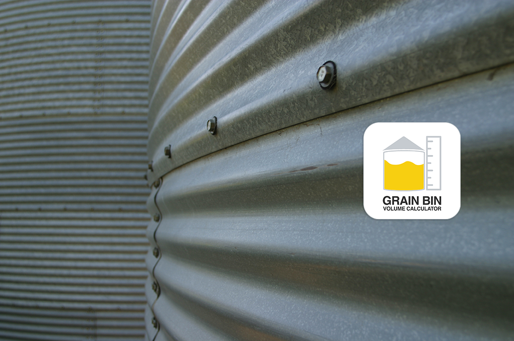 Close-up of a corrugated metal grain bin wall with bolts in focus, showing the Grain Bin Volume Calculator logo on the right side