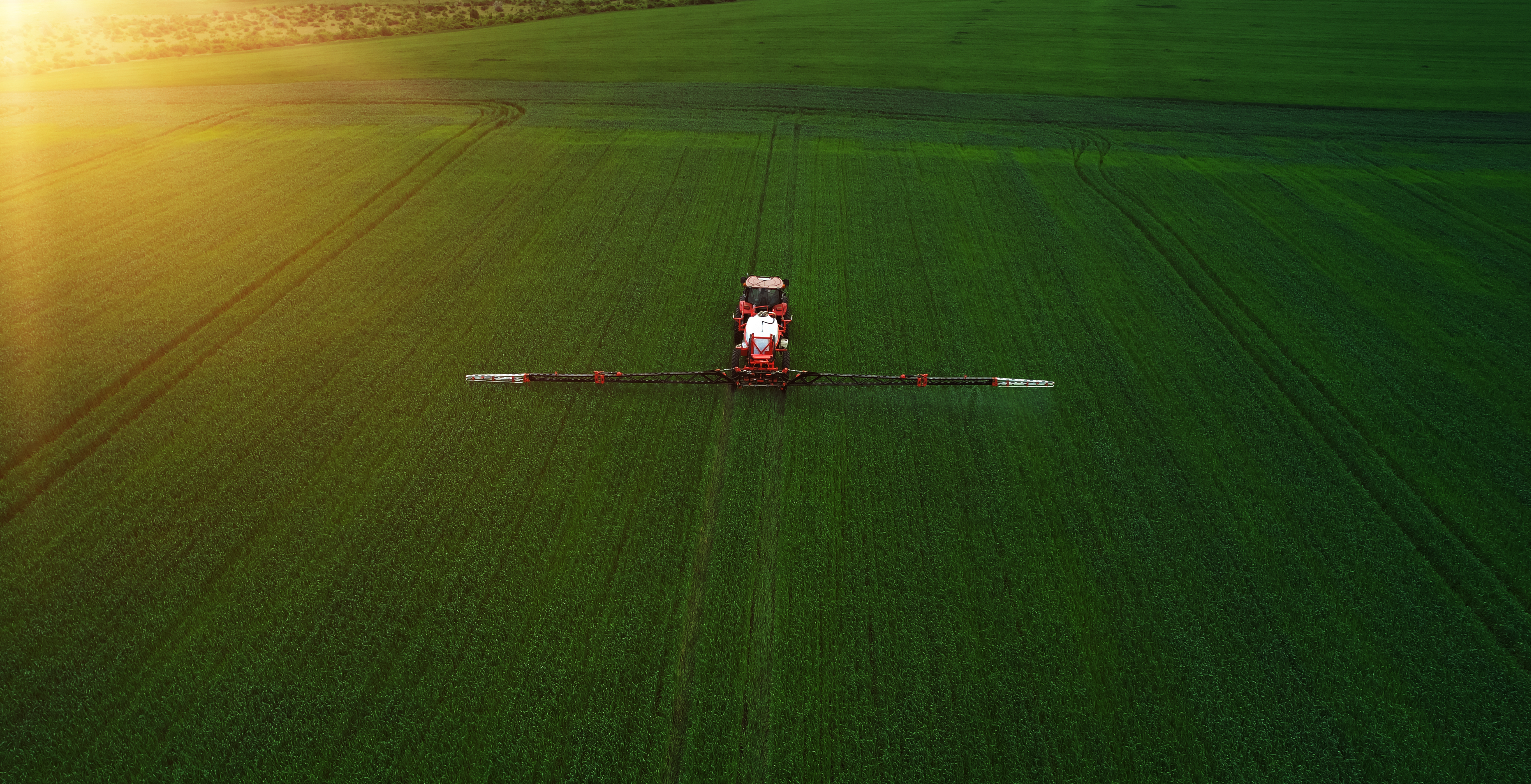 tractor spraying field