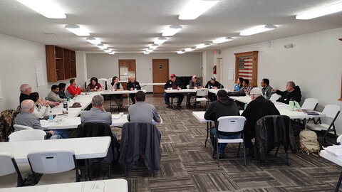 Meeting participants seated in a U-shaped table arrangement during the Shell Creek Watershed workshop, discussing conservation successes and future research needs