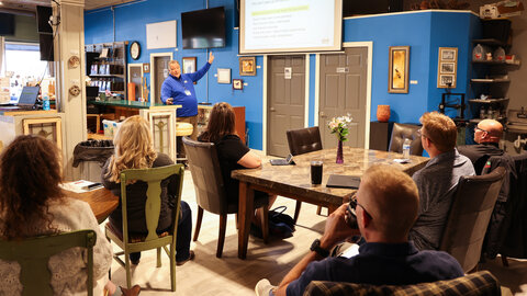 Odee Ingersoll, director of the Nebraska Business Development Center in Kearney, makes a slide presentation to several people in the Elston House maker space in Sidney, Nebraska.
