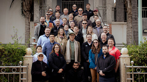 Nebraska LEAD Program class 43 students meet smile for a photo with agricultural leaders.
