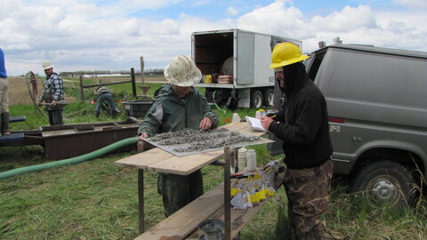 Sue Lackey, left, describes sediment samples to write on the field log and bag for further examination.