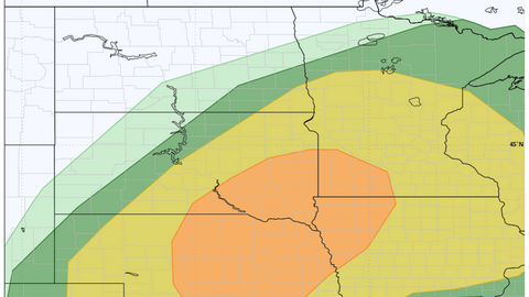 Color-coded severe weather risk map over the central United States, ranging from green to orange zones.