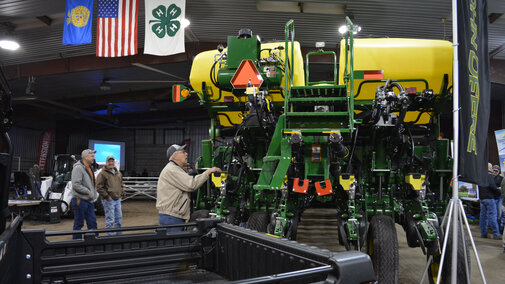 Grower examining a new sprayer at the Soybean Day and Machinery Expo