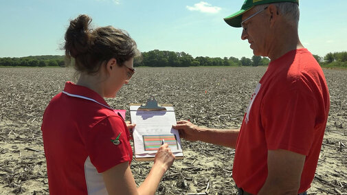 Laura Thompson and Dean Stevens in the field