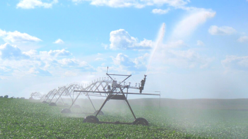 Center pivot irrigation system watering a field