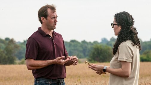 man and woman discussing business