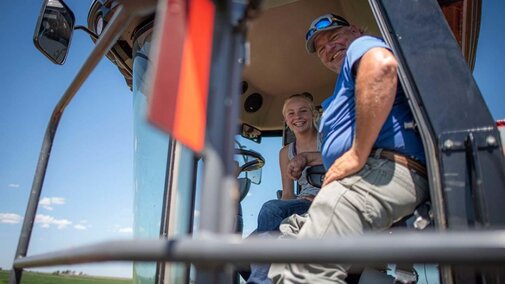 Farmers in tractor