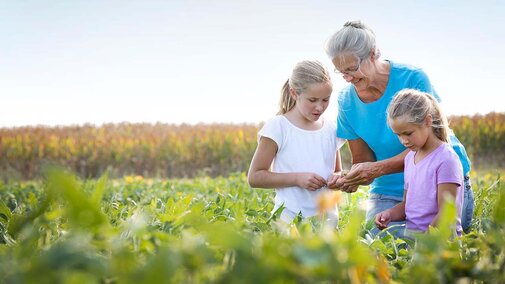 Farm family in field