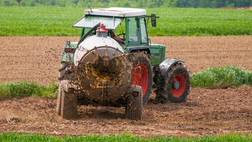 Tractor spreading manure