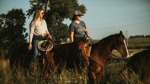 Farmers riding horses