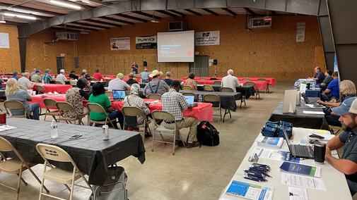 Expo attendees listen to speaker