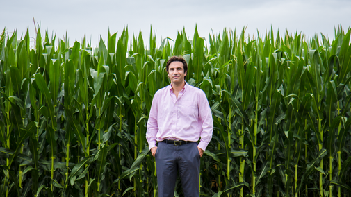 Patricio Grassini in front of corn field