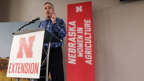 Man stands at podium