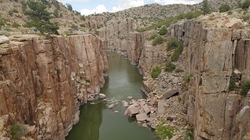 A canyon split by river water