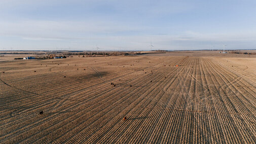 aerial photo of crop field and hay bales