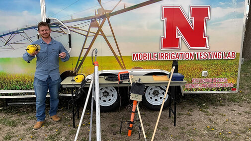 man stands near mobile lab
