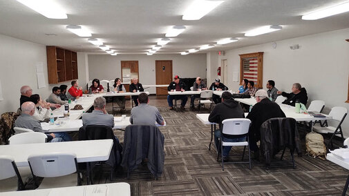 Meeting participants seated in a U-shaped table arrangement during the Shell Creek Watershed workshop, discussing conservation successes and future research needs