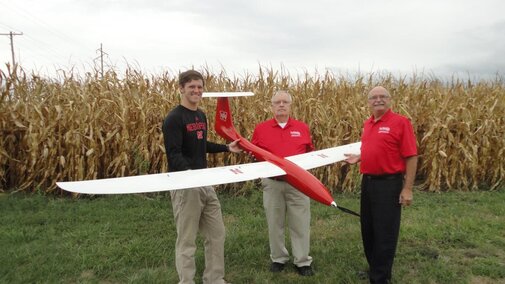 (From left) Matt Headrick, George Meyer and Wayne Woldt conduct a preflight check on an unmanned aircraft system. 