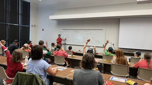 youth listen to lecture in classroom