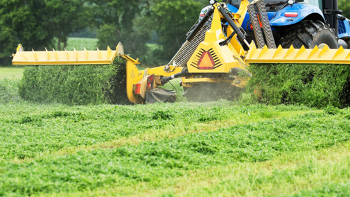 alfalfa harvester in field