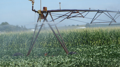 Center pivot irrigation system watering a field