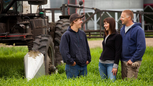 Farming family in field