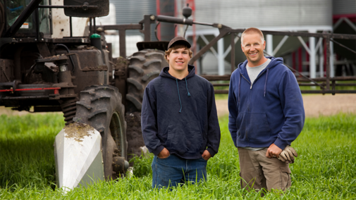 Man and son on farm