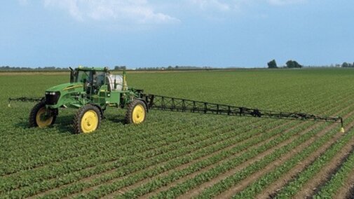 herbicide being applied to soybean field