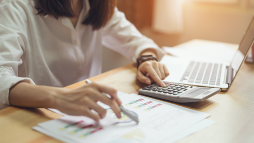 Woman working on financial papers