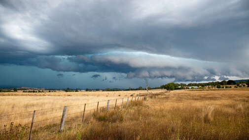 Hailstorm over farmland