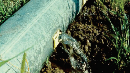 water flowing from irrigation pipe