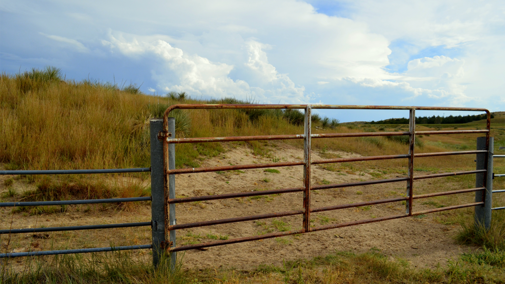 Gated fence on Nebraska pasture