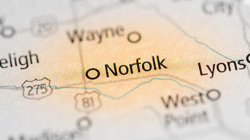 closeup of Nebraska map centered on the city of Norfolk which is highlighted in orange