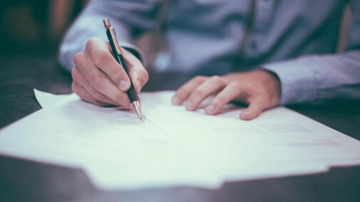 Man filling out paperwork