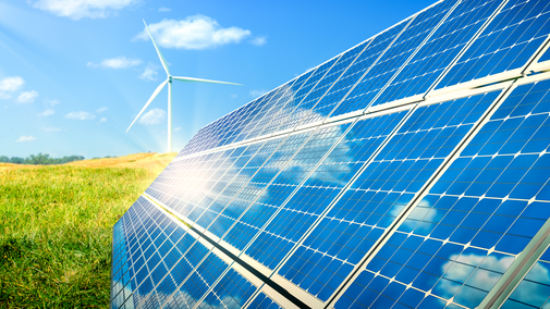 solar panel and wind turbine near cropland