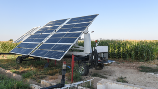Solar panels in front of corn field