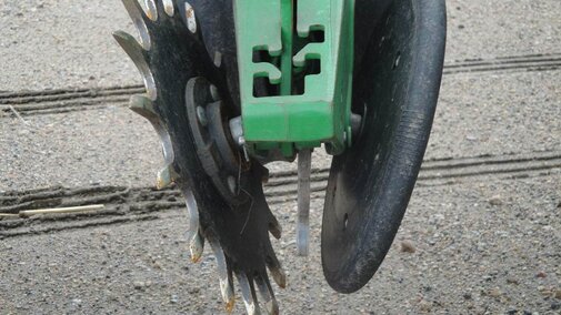 By replacing one solid closing wheel with a spiked one, closing the seed-vee becomes easier in a variety of conditions.