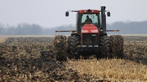 tractor filling a field