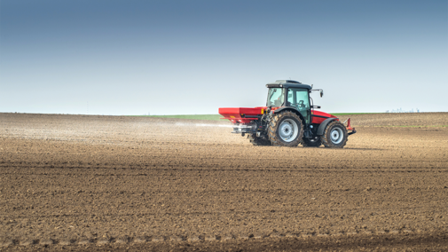 Tractor spraying fertilizer