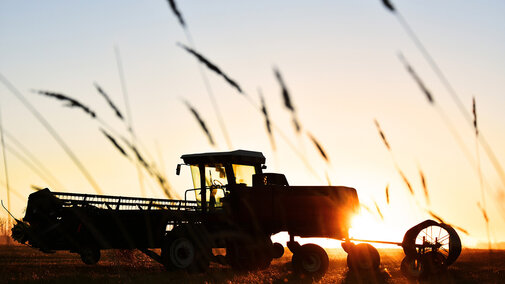 Tractor in field at sunset provides financial assistance for farmers, ranchers and forest landowners who experienced discrimination in USDA farm lending programs prior to January 2021. 